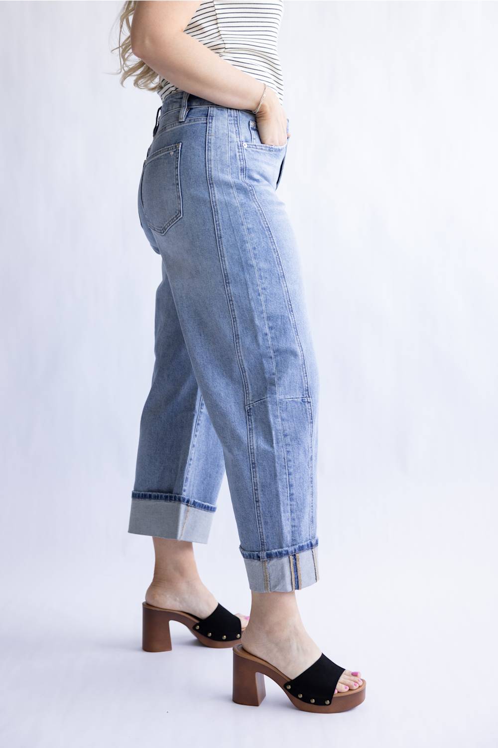 Mica High Rise Cuffed Barrel Jeans for Women; Person wearing light blue jeans and black sandals on a white background