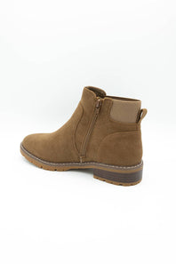 A single brown suede ankle boot with a side zipper, low block heel, and pull tab, shown from a side profile on a white background.