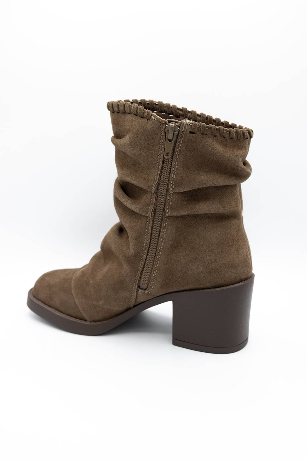 A single brown suede ankle boot with a slouchy, gathered design, a side zipper, and a chunky block heel, shown from a three-quarters angle on a white background.