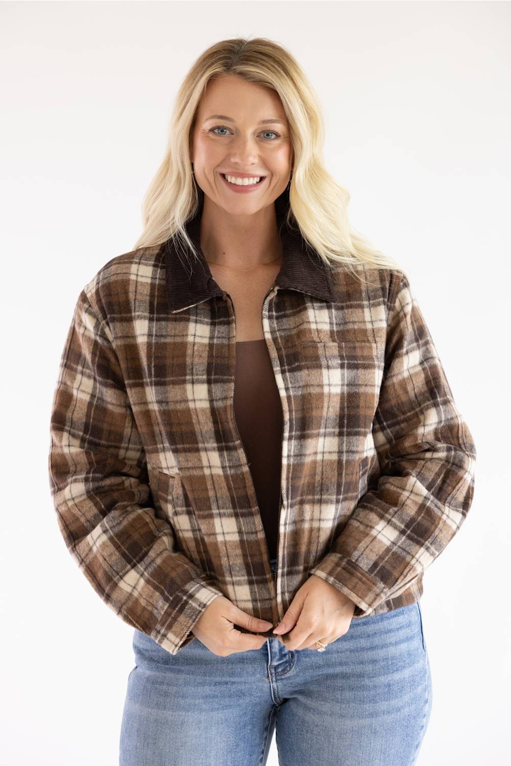 Model wearing the Brown and Cream Plaid Barn Jacket with a dark brown corduroy collar, featuring a relaxed fit, front zipper, and long sleeves.