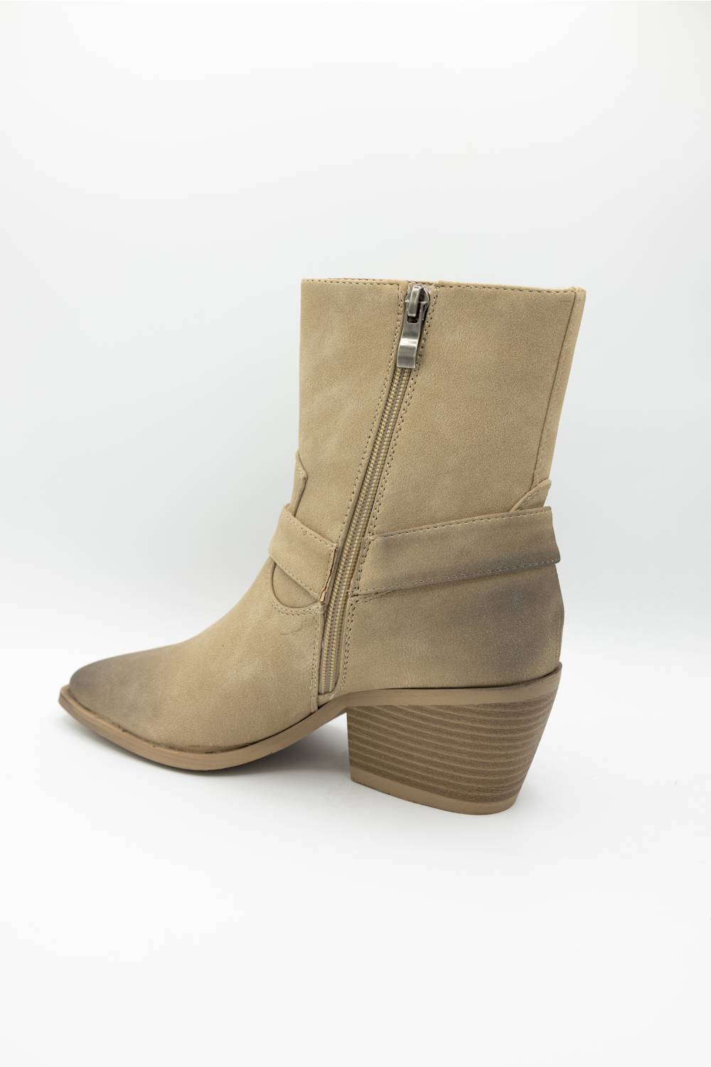 A beige suede ankle boot with a side zipper, stacked block heel, and pointed toe, shown from a side profile view on a white background.