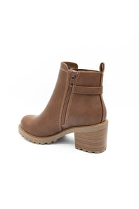 A brown leather ankle boot with a block heel, a side buckle strap detail, and a lug sole, shown on a plain white background.