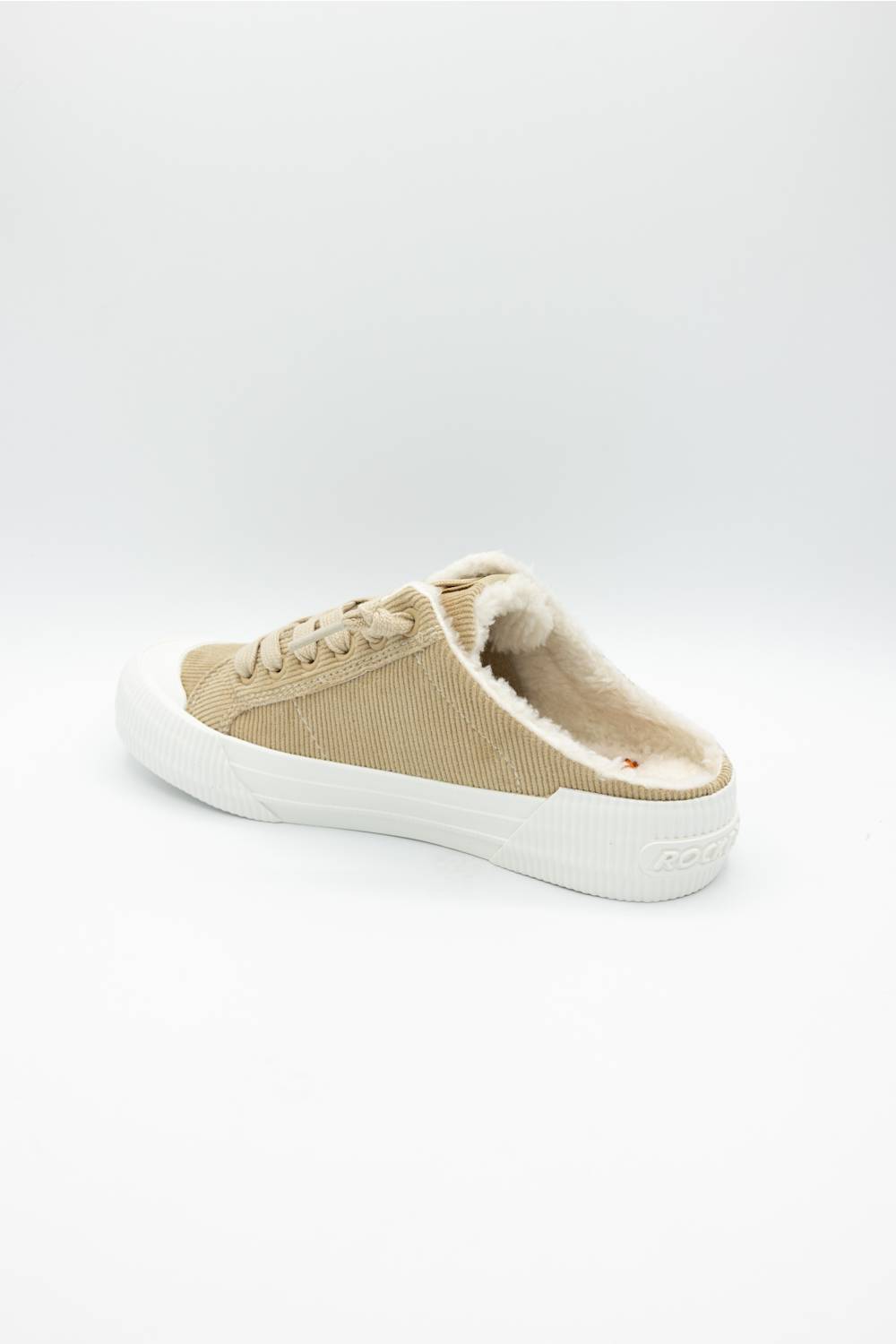A single low-top slip-on sneaker in beige canvas with a white rubber sole, shown from the side on a light gray background.