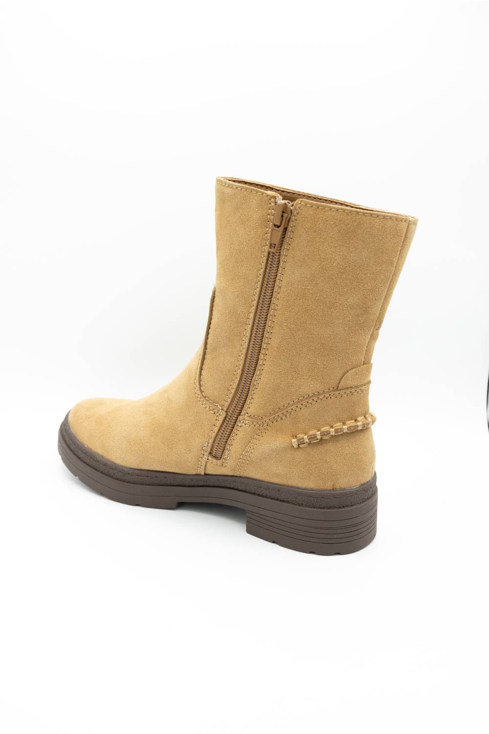 A tan suede ankle boot with a side zipper, brown sole, and decorative chain detail on the heel, shown from a side-rear angle on a white background.