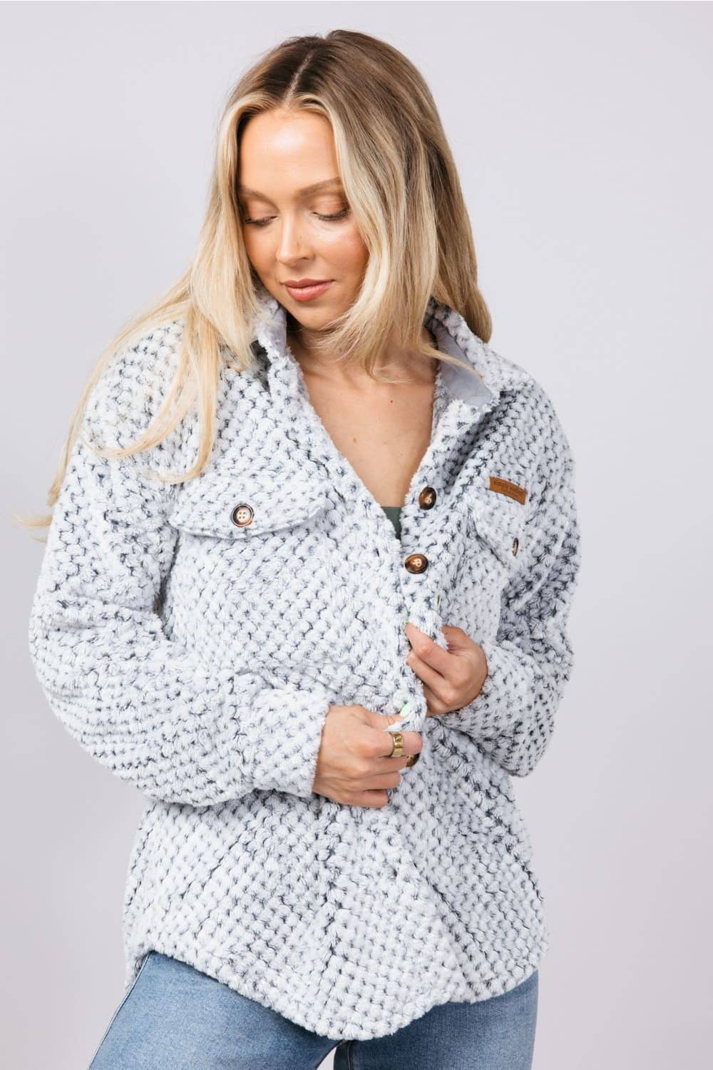 Soft fleece button up shacket with cuffs, and tortoiseshell buttons and chest pockets 