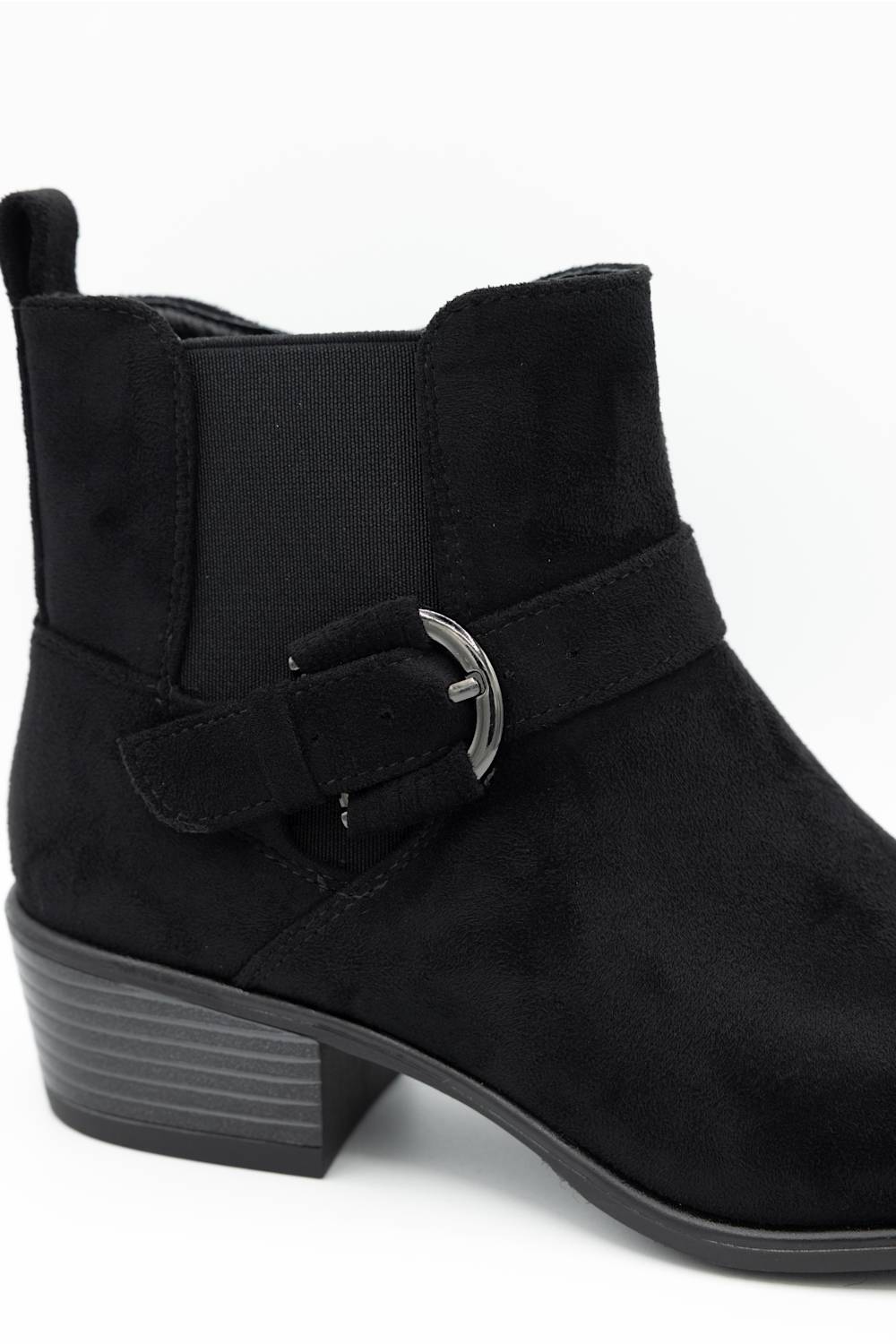 A black suede ankle boot with a side strap and silver buckle, shown from a three-quarters angle on a white background.