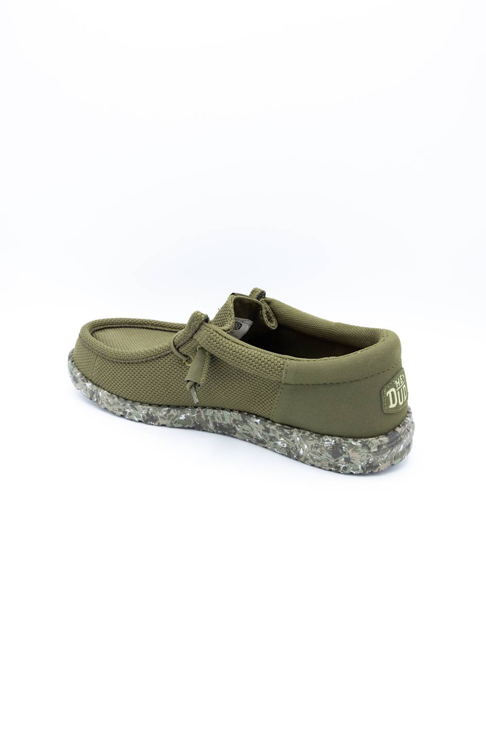 An olive green slip-on shoe with a textured knit upper, matching fabric tie detail, and a speckled gray and white sole, shown from a side-rear angle on a white background.