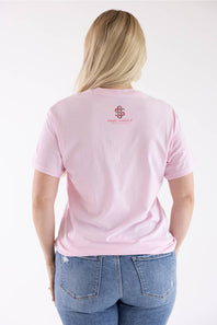 back view of a woman modeling a shirt with simply southern logo 