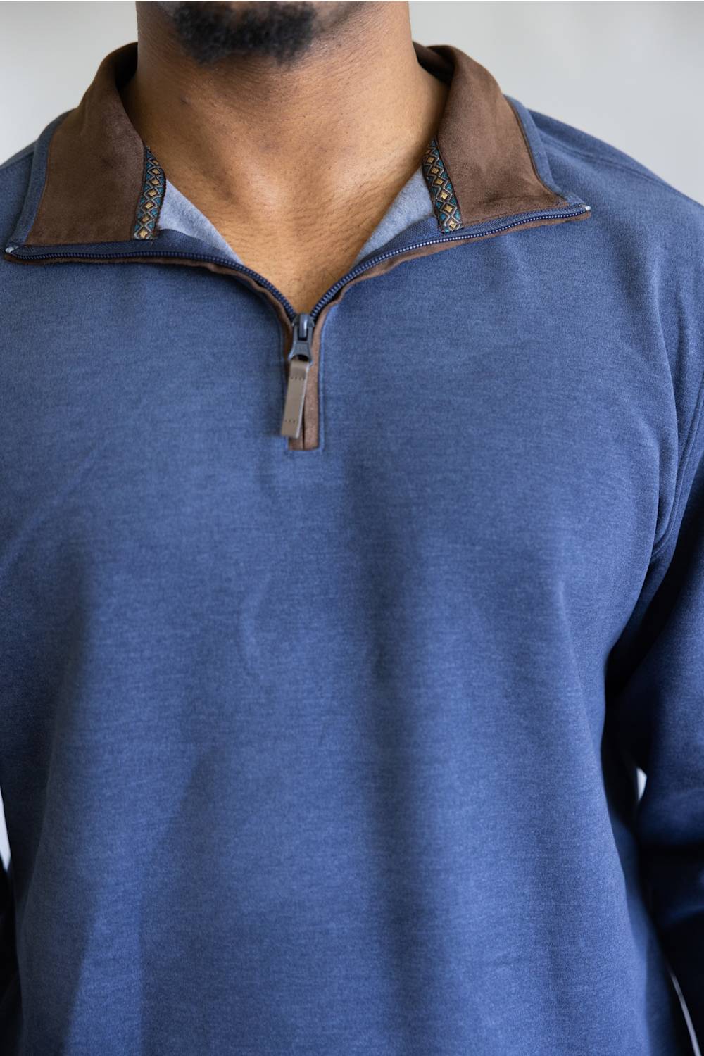 Butter soft, zipneck sweater with brown zipper and collar accents 