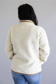 Woman viewed from the back wearing a sherpa fleece pullover