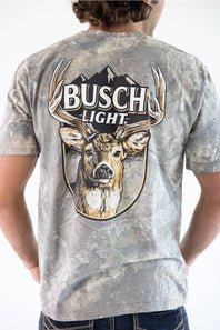 Back view of a man wearing a camo JEDCo t-shirt featuring a large Busch Light logo and a whitetail deer graphic printed on the back.