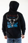 A person wearing a black hoodie from the back, featuring a large graphic print of a white bull skull over blue desert-style artwork, with 'ARIAT' and 'LAND OF THE FREE' text. The person is also wearing blue jeans against a plain white studio background.
