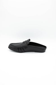 A single black leather slip-on loafer mule shown in profile against a clean white background.