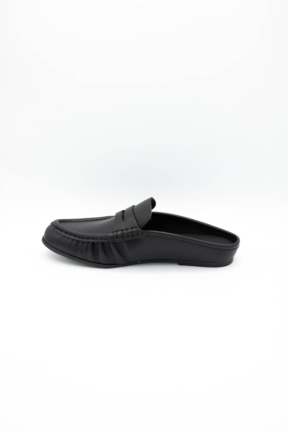 A single black leather slip-on loafer mule shown in profile against a clean white background.