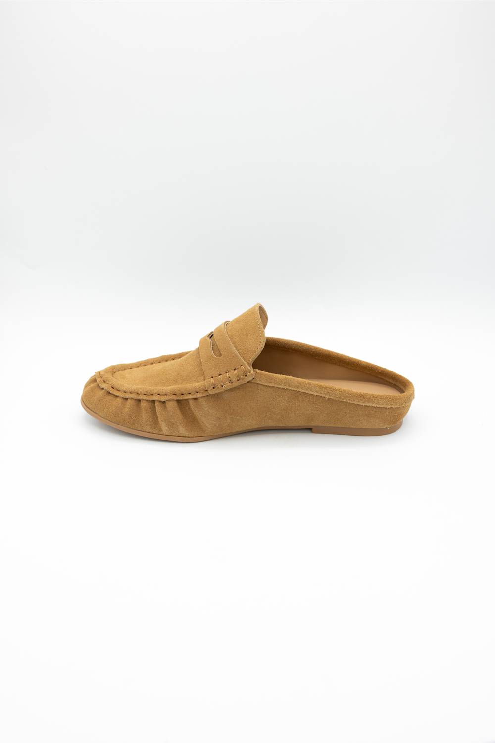 A single tan suede mule loafer shown in profile against a clean white background.