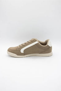 A low-top sneaker in taupe brown suede with a contrasting white side stripe, white heel tab, and a beige sole, shown from a side profile view against a light gray background.