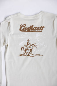 An off-white Carhartt long-sleeve t-shirt featuring a brown graphic print of a cowboy riding a horse beneath the Carhartt logo, displayed flat against a light background.