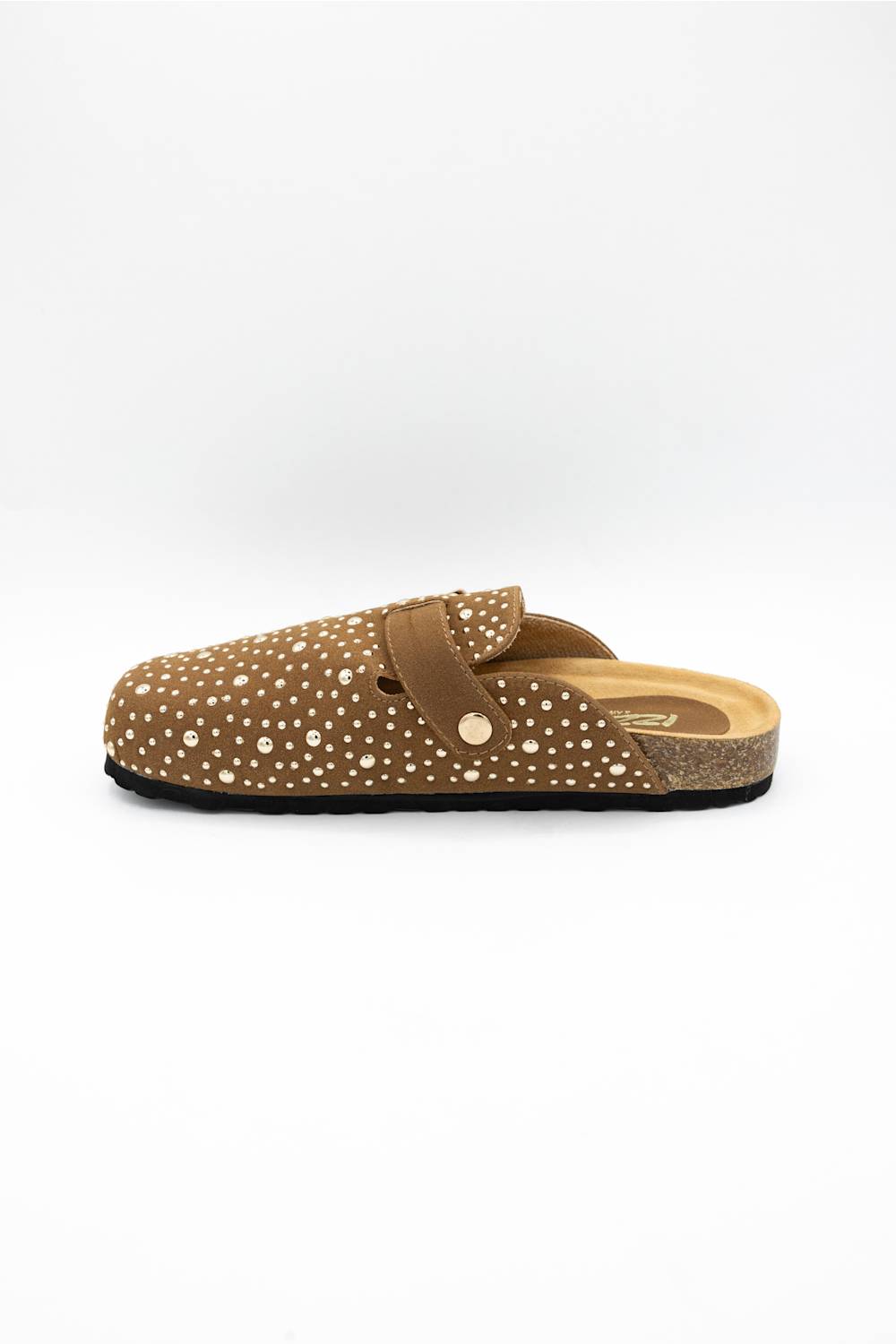 A single brown clog-style mule shoe with white polka dots, a brown strap with a gold-tone button, and a cork-textured midsole, shown against a plain white background.