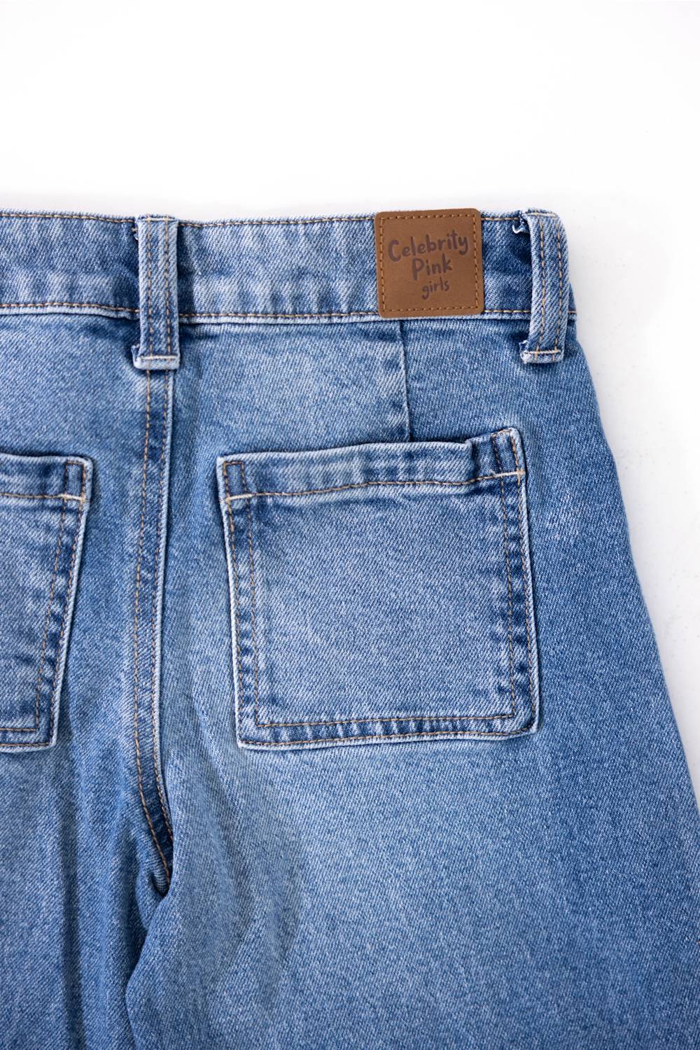 Back pocket of jeans showing logo tag
