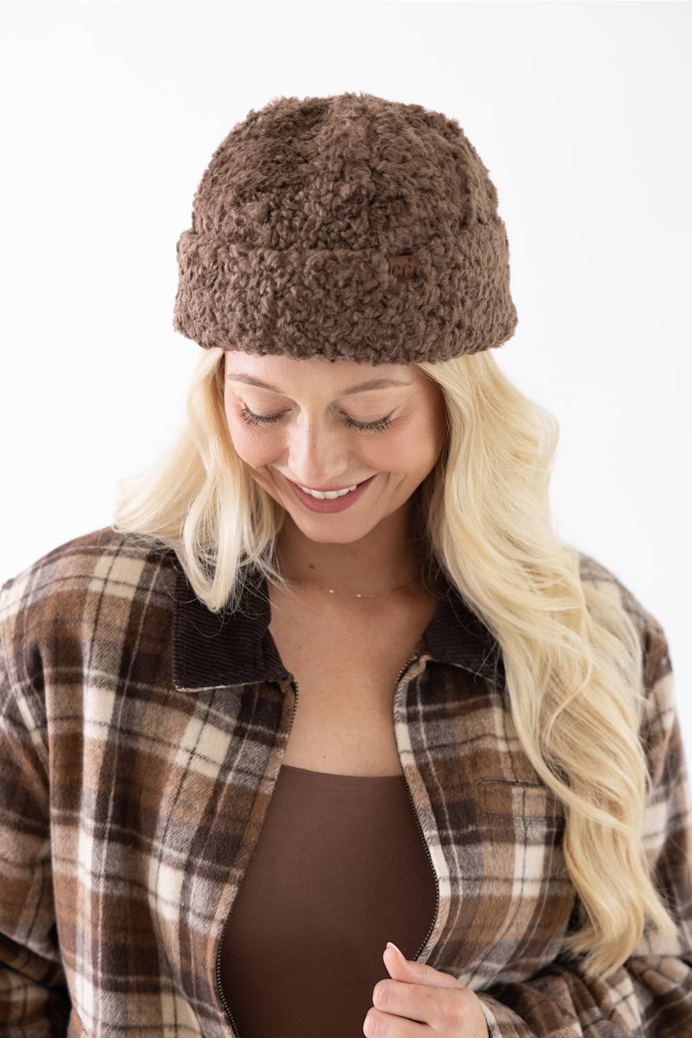 Blonde woman modeling a brown fur fisherman hat 