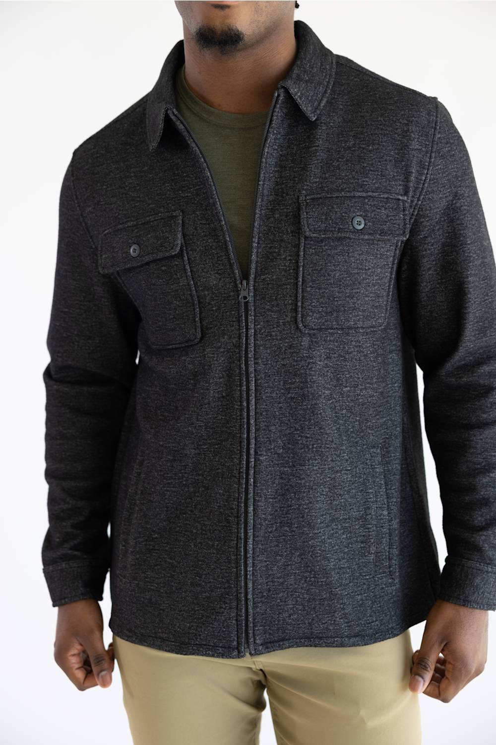 A man wearing a Hallstatt full zip Knit Jacket for Men in Charcoal Grey with two chest pockets.
