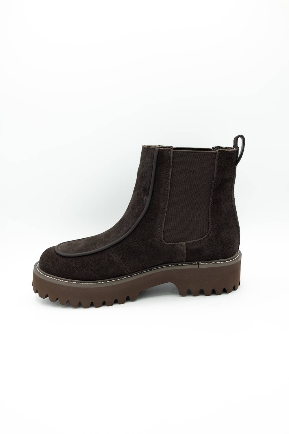 A dark brown suede Chelsea boot with a chunky lug sole, shown from a side profile view against a plain white background.