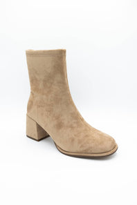 A single beige suede ankle boot with a chunky block heel and square toe, photographed from a three-quarters angle on a white background.