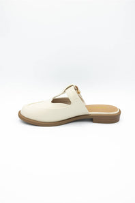 A single off-white leather mule sandal with a low brown heel and a small gold buckle detail, shown from a side profile on a white background.