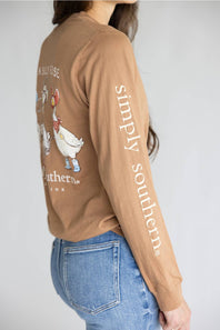 A brown long-sleeve t-shirt with a graphic of three western-style geese on the back, featuring the text 'JUST A SILLY GOOSE' and 'simply southern.' on the back, and 'simply southern.