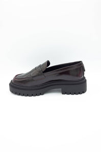 MIA Henrik Platform Loafers in wine red leather, featuring a chunky lug sole, round moc toe, and profile view of the heel and platform detail, displayed against a plain white background.