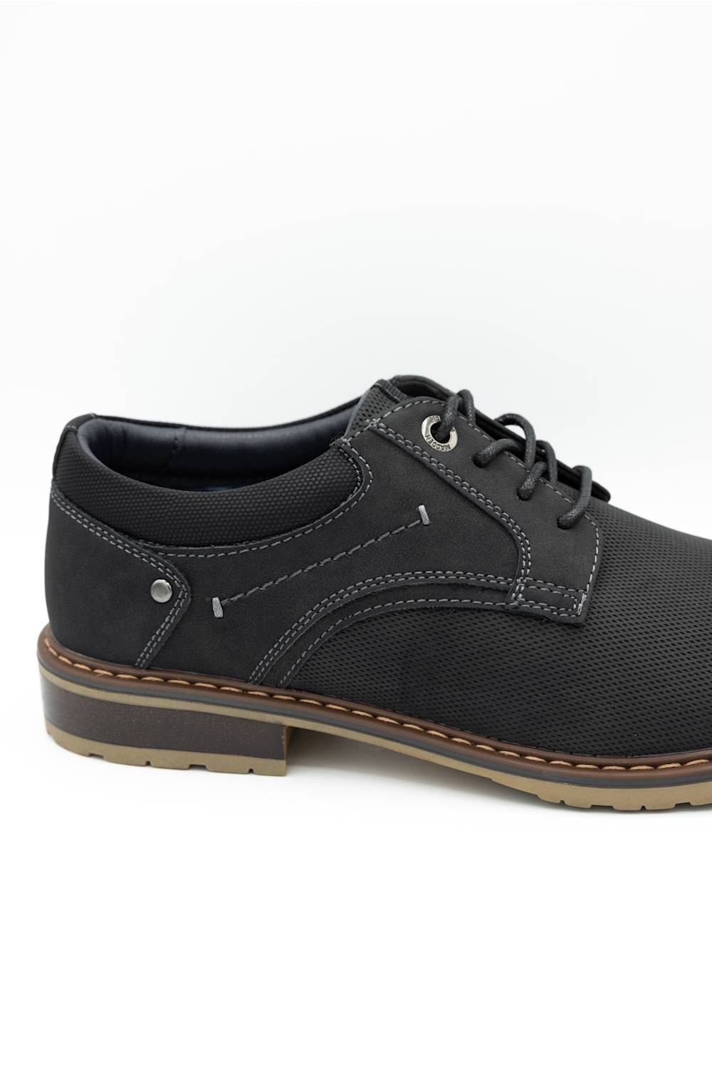A black lace-up shoe with a textured upper, black laces, and a brown and beige sole, shown from a side profile on a white background.