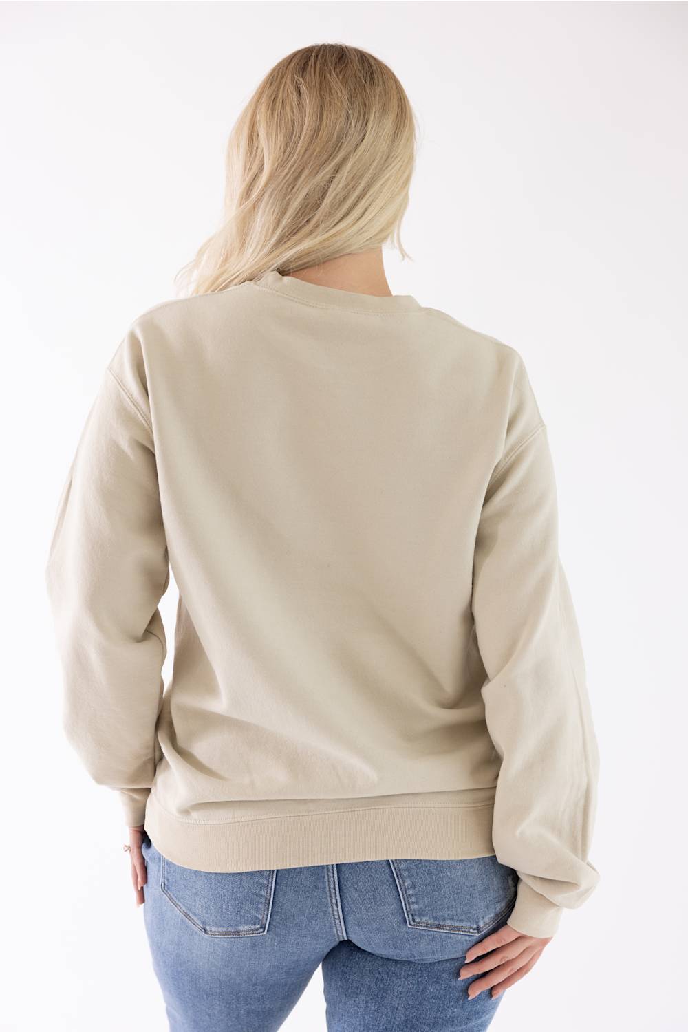 Model wearing the Mallard Duck Sweatshirt for Women in Cream, shown from the back wearing blue jeans, highlighting the relaxed fit, long sleeves, and ribbed hem.