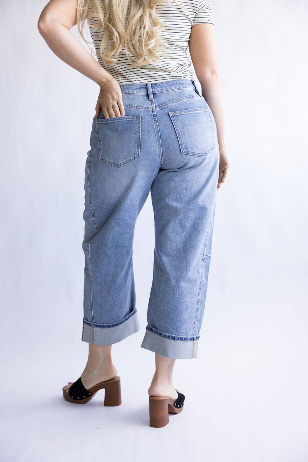 Mica High Rise Cuffed Barrel Jeans for Women; Person wearing light blue jeans and a striped shirt on a white background