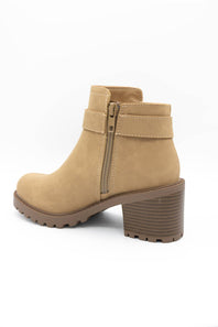 A tan suede ankle boot with a side zipper, a matching strap detail, and a chunky brown block heel, shown from a side profile on a white background.