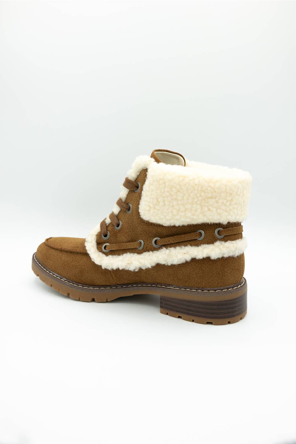 A brown suede lace-up ankle boot with a thick cream-colored shearling lining and a brown stacked heel, shown from a side profile on a white background.