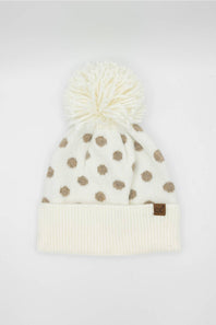 cream and brown polka dot beanie on a white background 