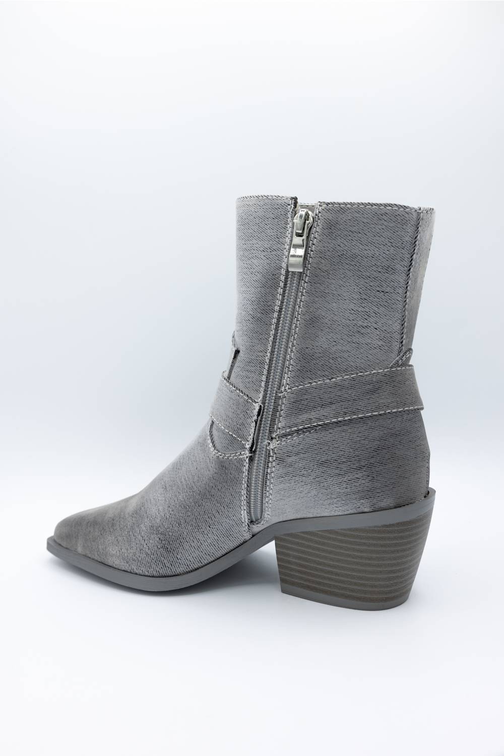 A single gray suede ankle boot with a side zipper, shown from a three-quarters angle against a white studio background.