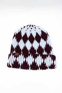 A knit beanie hat with a burgundy and white diamond pattern, featuring a ribbed cuff and a small brown leather brand tag on the front.