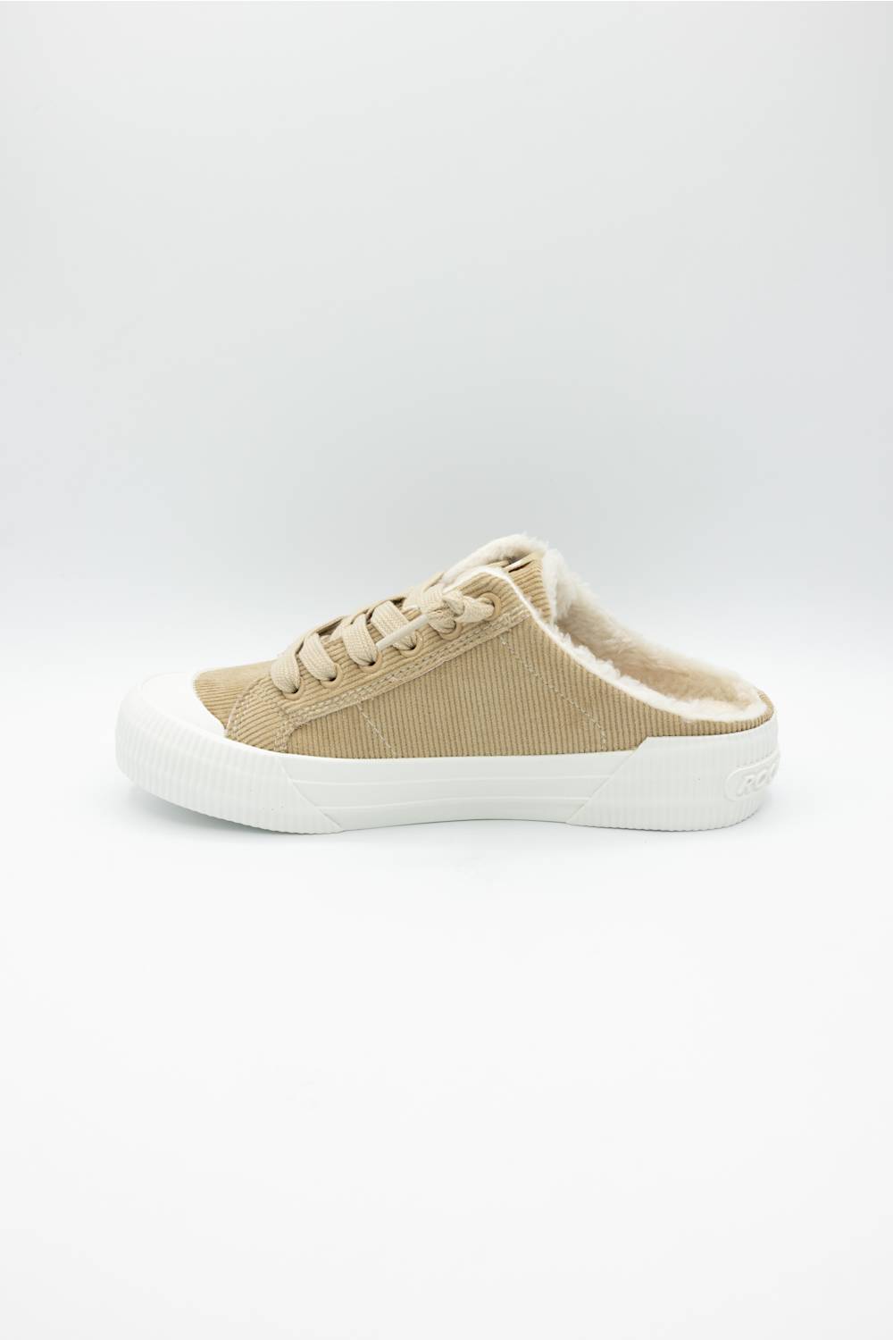 A single low-top slip-on sneaker in beige canvas with a white rubber sole, shown from the side on a light gray background.