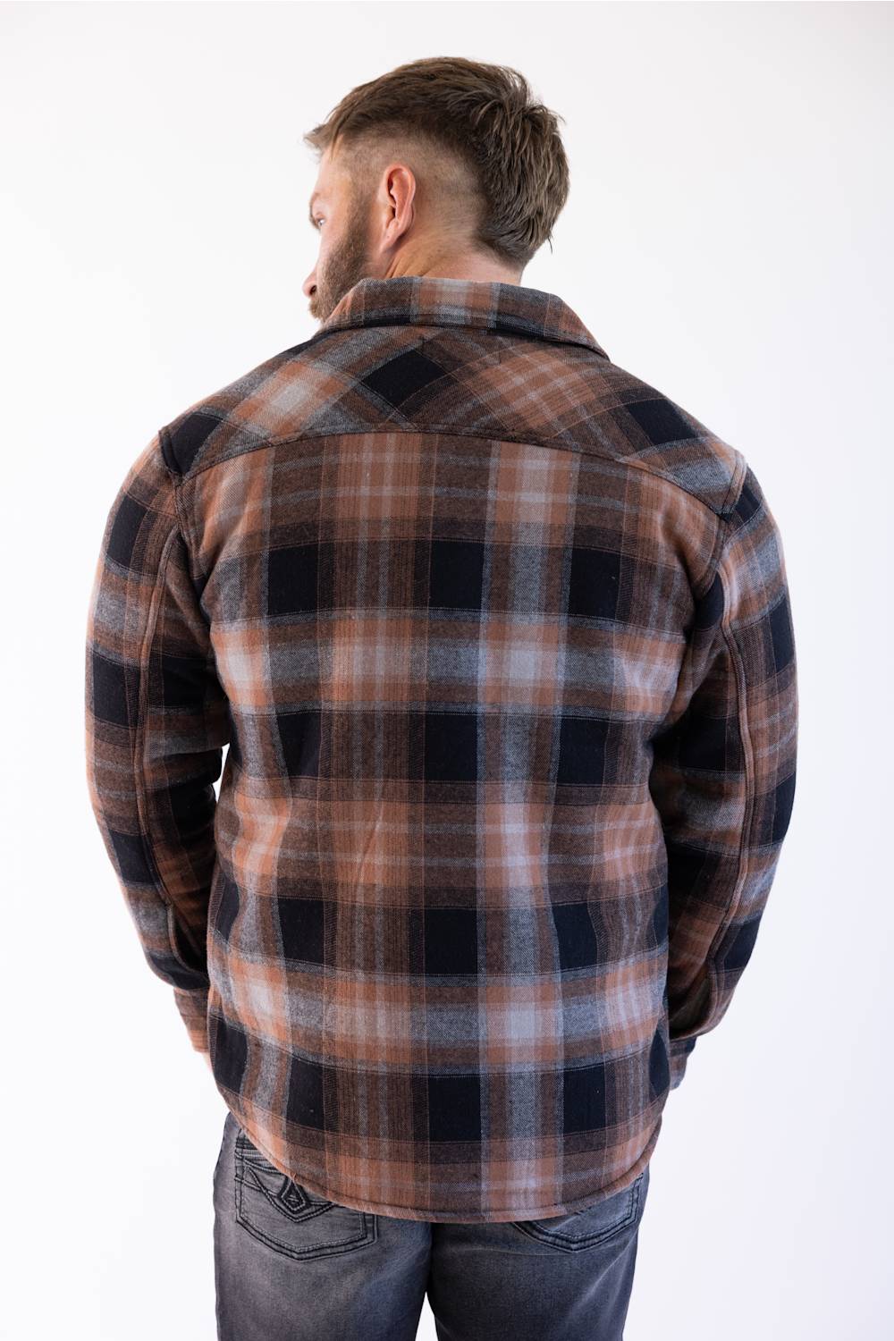 Matix Sherpa Lined Flannel Shacket in Black and Brown showing back view of shacket