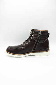 A dark brown leather lace-up ankle boot with a side zipper, metal eyelets, and a white sole, shown from a side profile on a white background.