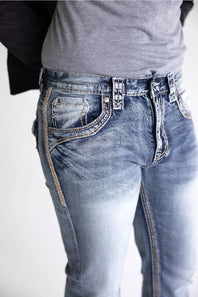 Close-up of a person wearing light blue denim jeans with a faded wash, showing the front and side pockets, waistband, and belt loops against a plain light background.