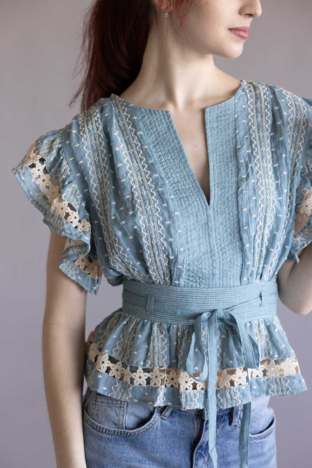 Embroidered Flutter Sleeve Peplum Top for Women in Chambray