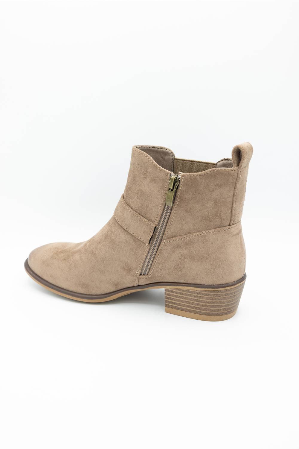 A taupe suede ankle boot with a side zipper, low stacked block heel, and pull-on silhouette, shown from a side profile on a white background.
