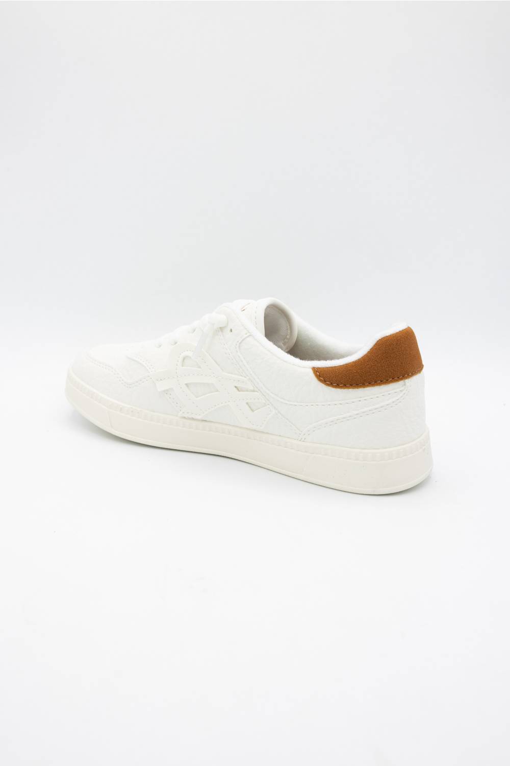 A white low-top sneaker with a textured embossed pattern on the upper and a contrasting brown heel tab, shown from a side profile on a white background.