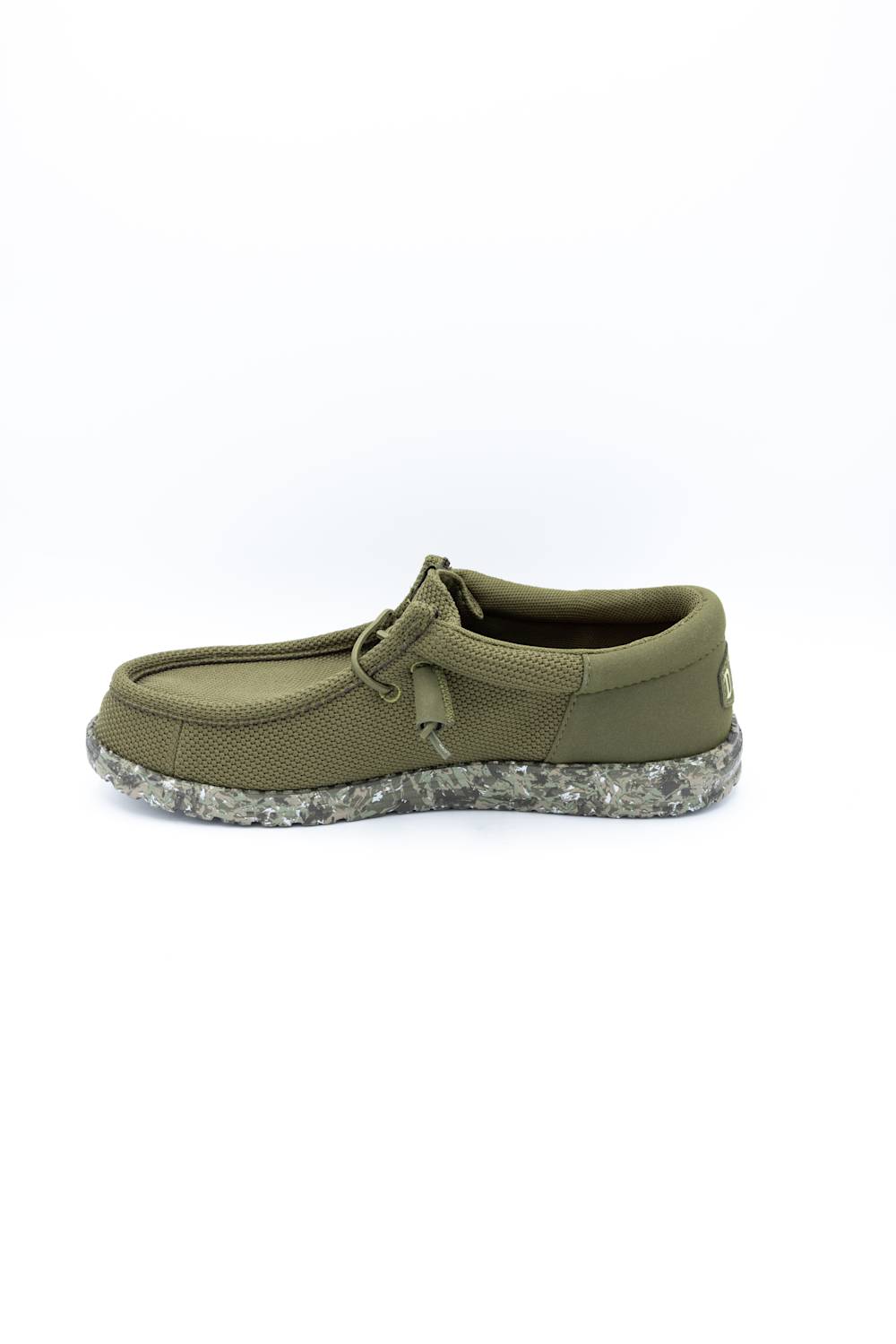 An olive green slip-on shoe with a textured knit upper, matching fabric tie detail, and a speckled gray and white sole, shown from a side-rear angle on a white background.