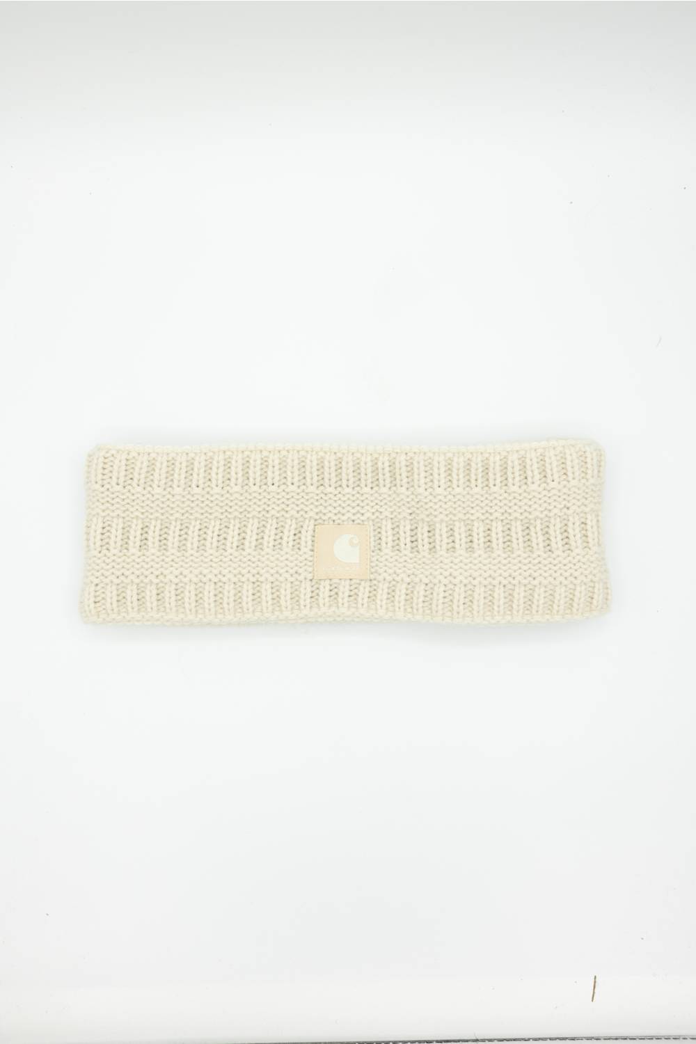 SATIN LINED CARHARTT HEADBAND LAID ON A WHITE BACKGROUND