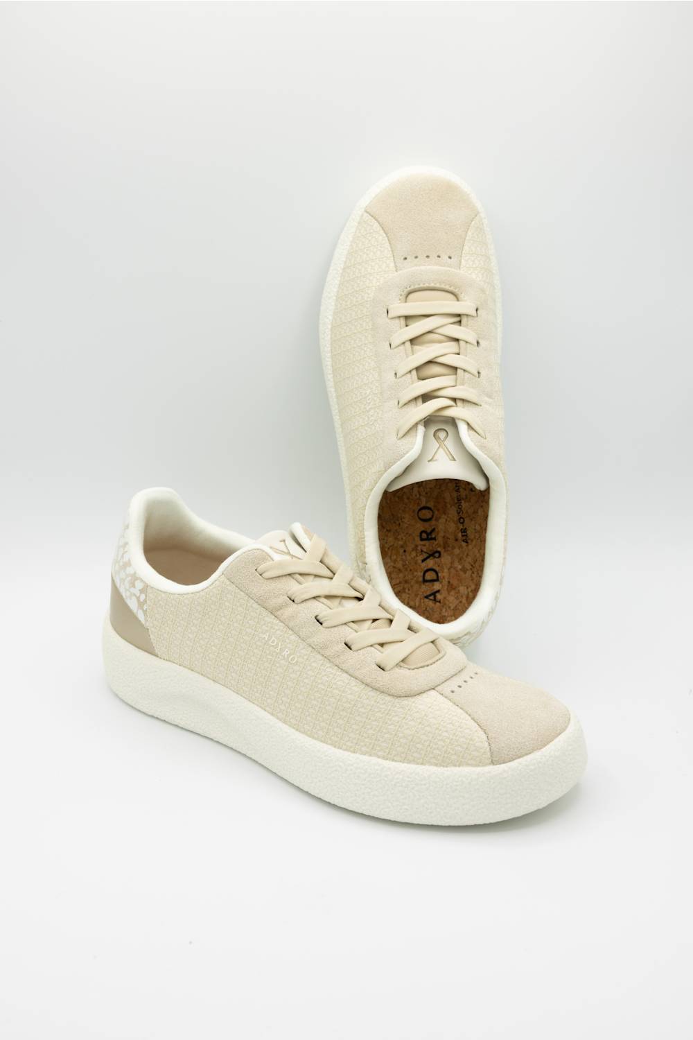 ADYRO Prima Sneakers for Women in Almond Beige; Pair of beige sneakers on a light gray background