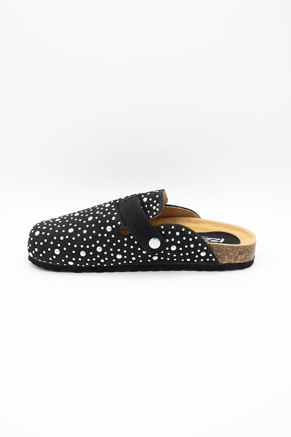 A single black clog-style mule shoe with white polka dots, a black strap, and a cork midsole, shown in profile against a plain white background.