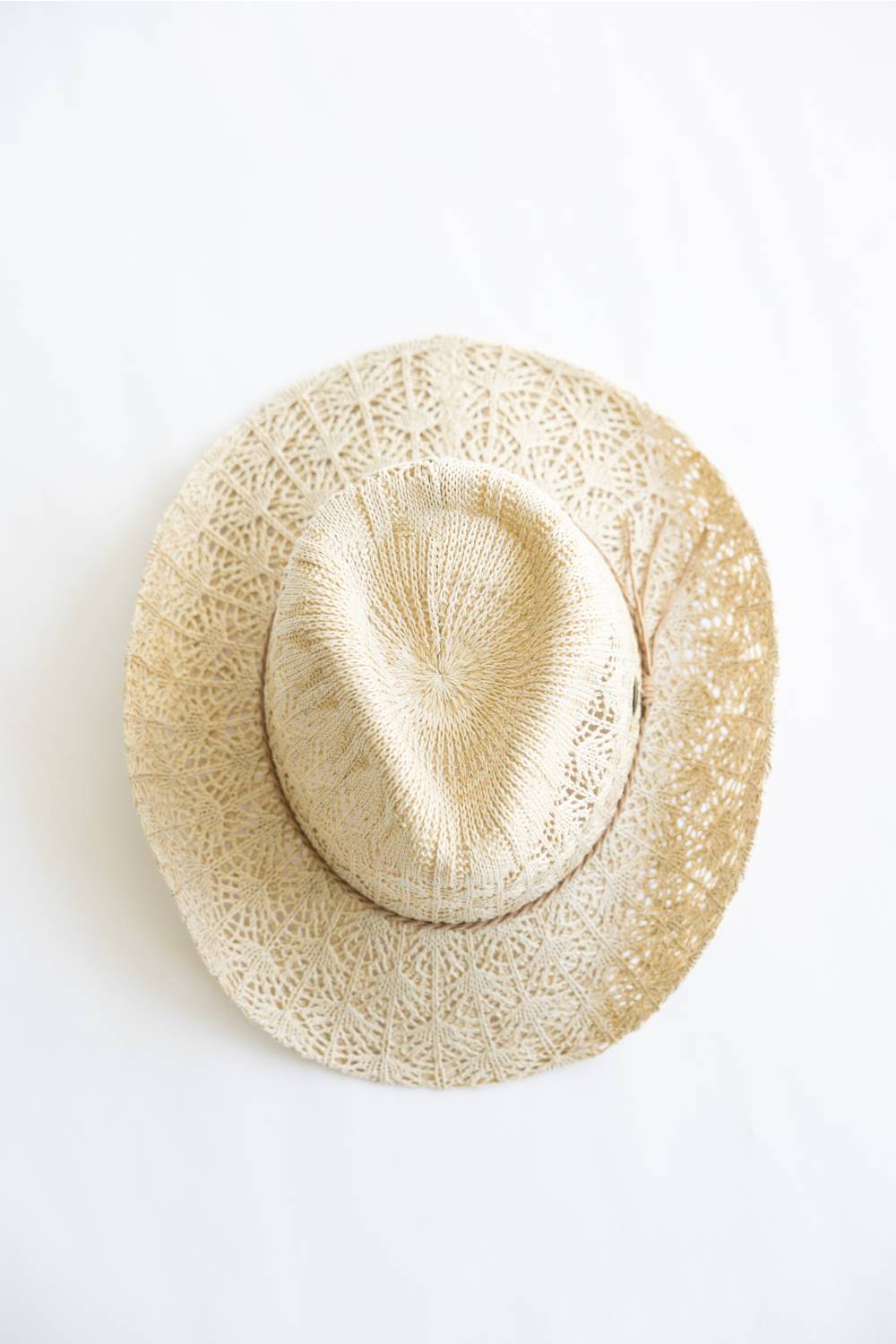 Beige straw hat on a white background